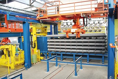 Sistema automatizado de apilado y desapilado de tochos de aluminio
